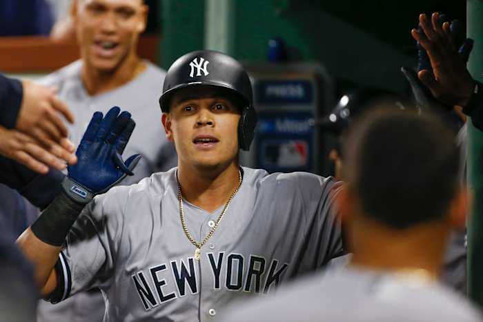 Gio Urshela high fives in dugout